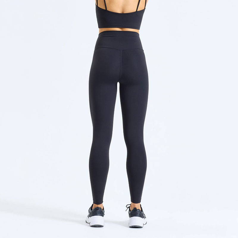 Rear view of black high-waisted sculpt leggings, smooth contour fit womenโs activewear.